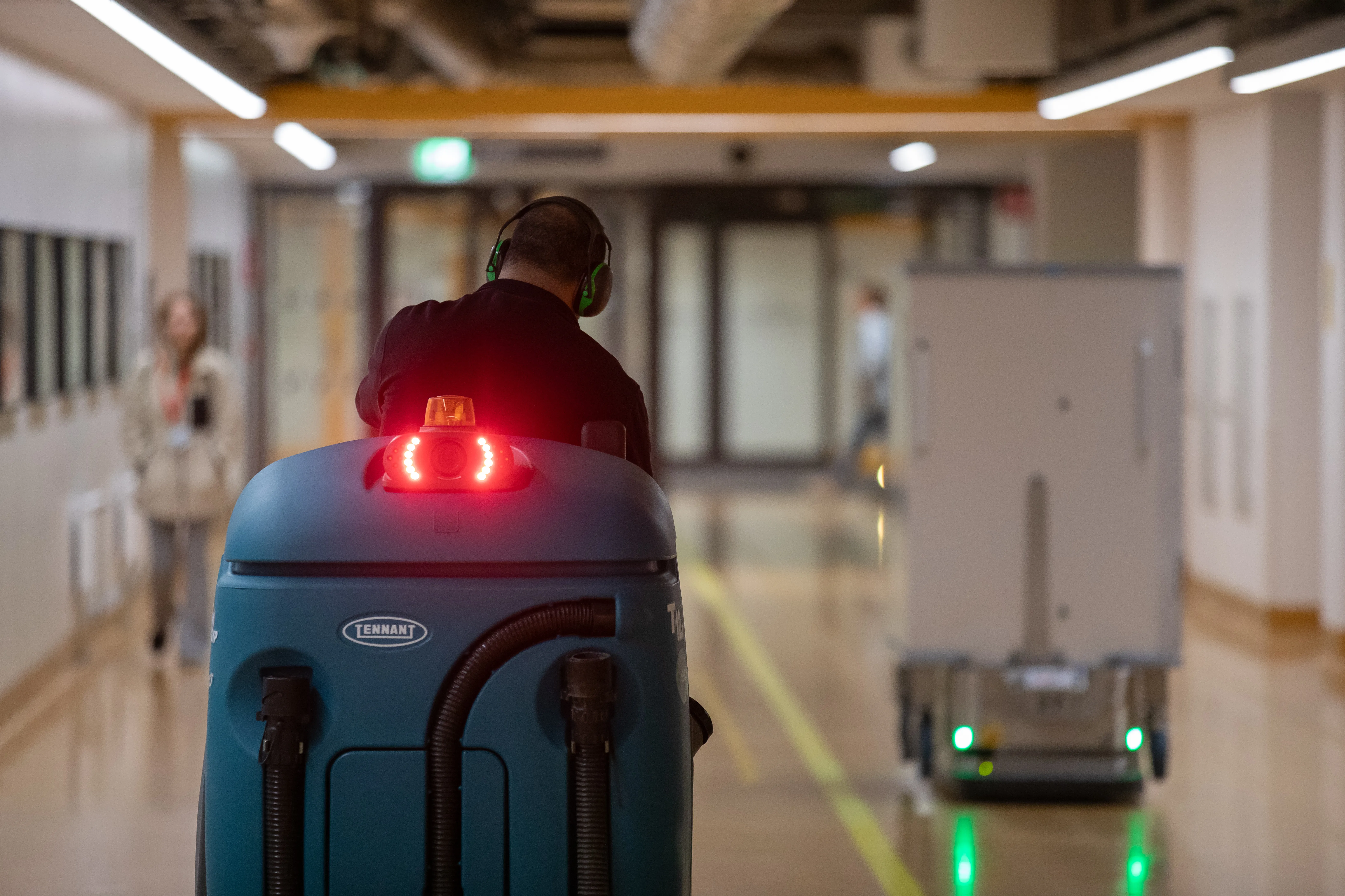 Man sitting on cleaning machine